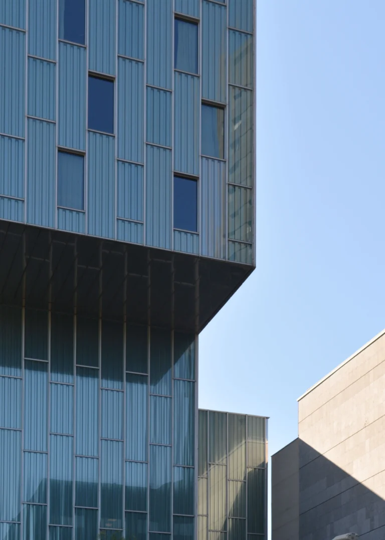 A tall building with a full glass front